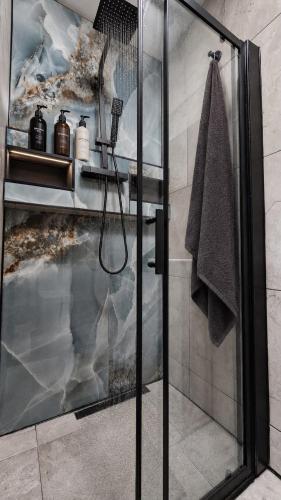a shower with a glass door in a bathroom at The Studio Spot in Caerphilly