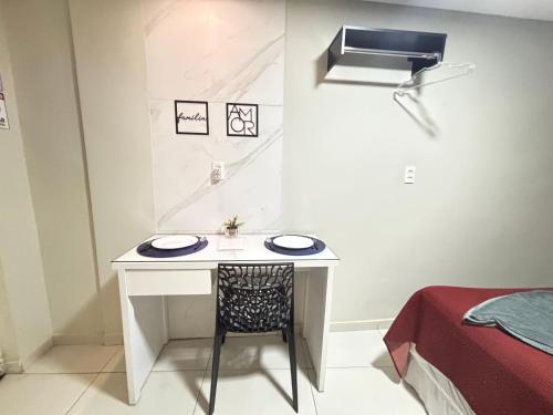 a white desk with a chair in a room at Flats 1778 N01 Orla de Petrolina in Petrolina