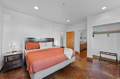 a bedroom with a large bed and a bathroom at 57 Robber's Roost in Moab