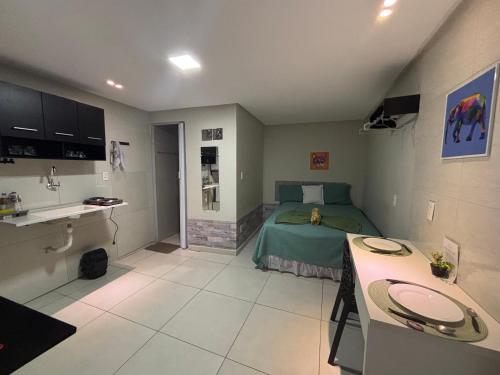 a bedroom with a bed and a sink in it at Flat 1778 N2 Orla Petrolina in Petrolina