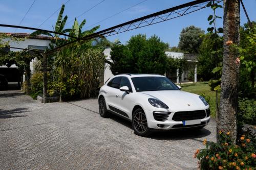 a white car parked in a driveway at Casa da Tapada - Grupo Casas Vale do Lima in Ponte de Lima