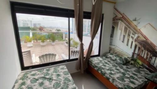 เตียงในห้องที่ Markasa Hotel boutique
