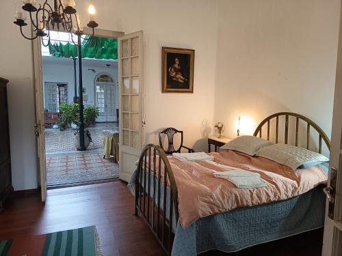 a bedroom with a large bed in a room at Casa rosa 2 in Mercedes