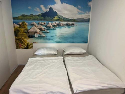 a bedroom with two beds and a painting on the wall at Mobile Home ABC in Donji Karin