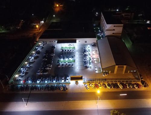 an aerial view of a parking lot at night at Garoto Park Hotel in Floriano