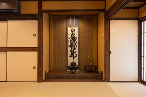 an entrance to a room with two doors at Temple Stay KAN 観 in Yokosuka