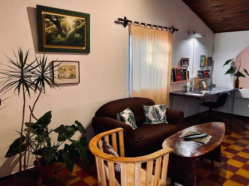 a living room with a couch and a table at Casa Toia - Cerca del río, cerca de vos in Posadas