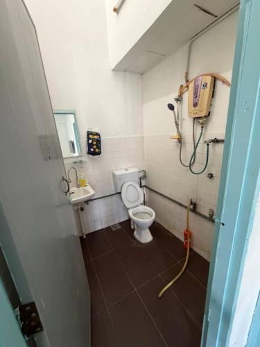 a bathroom with a toilet and a sink at Stellas house in Langkawi Islands
