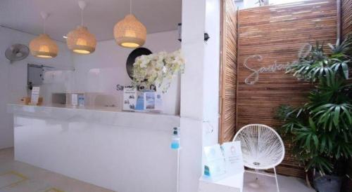 a room with a white refrigerator and a fan at Sawasdee Coco Resort in Ko Samed
