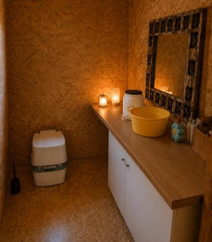 a small kitchen with a counter with a sink and a counter at Lake View Glamping pod Radyní bez tekoucí vody s omezenou elektřinou in Hvížďalka