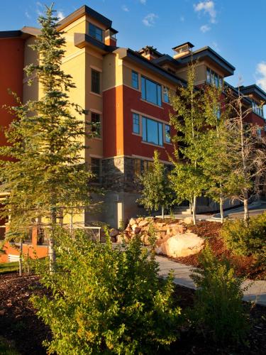 a large building with trees in front of it at Raintree's The Miners Club Park City in Park City