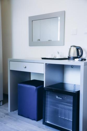 a white desk with a tea kettle on top of it at Reflection of the Bosphorus in Istanbul