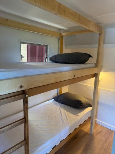 two bunk beds in a small room with a window at Bordagorria 