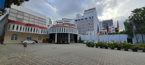 a parking lot in front of a building at Ambassador Pallava in Chennai