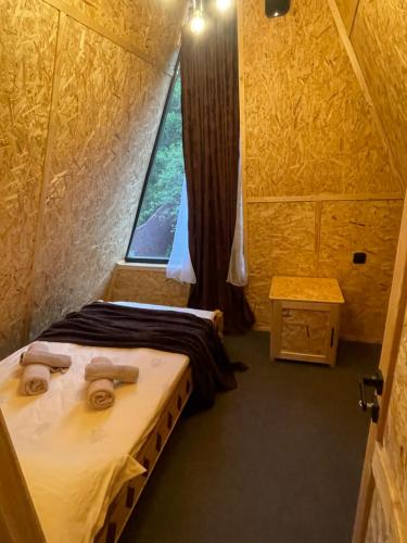 a small room with two beds and a window at Hayrapet Asatryan in Arzakan