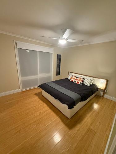 a bedroom with a bed and a ceiling fan at Yokomokko House in Bridgewater