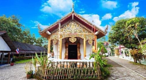 a small building in front of a building at Feel good in Pai