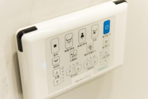 a close up of a microwave oven control panel at Hotel Nanta Jeju in Jeju