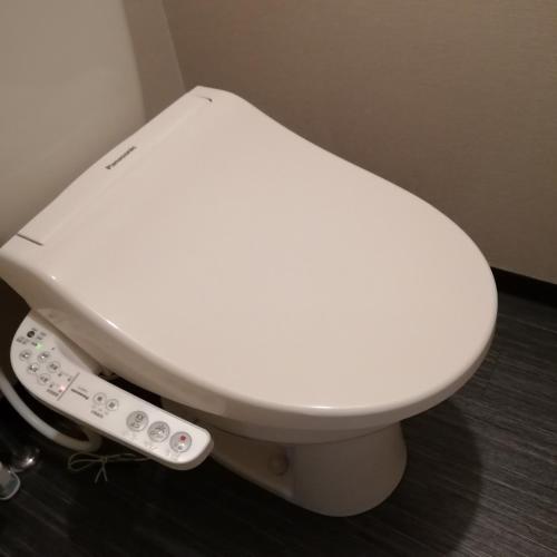 a white toilet with a remote control on it at ARASHIMA INN 201 / Vacation STAY 162 in Toba