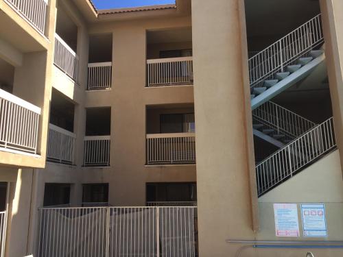 an apartment building with balconies on the side of it at Chula Vista Inn in Chula Vista