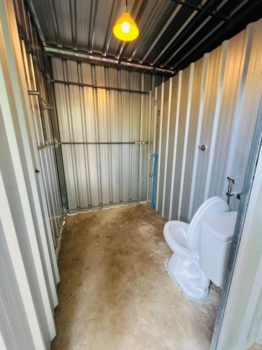 a bathroom with a toilet and a sink at Zulu land Kohlarn in Ko Lan