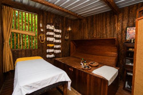 a small room with a bed and a window at Bliss Stay in Katugastota