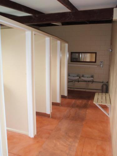 an empty room with a sink and a bench at Russell-Orongo Bay Holiday Park in Russell