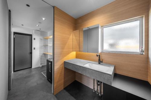 a bathroom with a sink and a window at S - Vacation STAY 20201 in Asahikawa