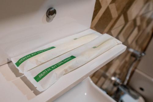 two rolls of toilet paper sitting on top of a sink at Quba Qala Resort in Quba