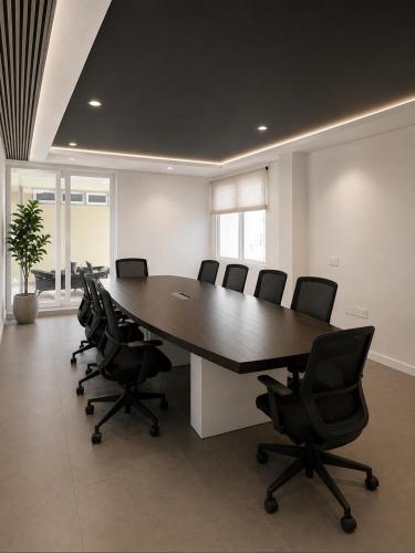 a conference room with a large table and chairs at Vintage Bak Holidays in Vythiri