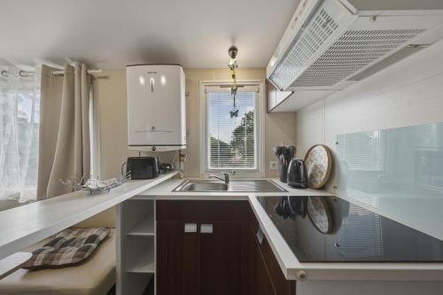 a kitchen with a sink and a counter top at NATALiHAUS in Děčín
