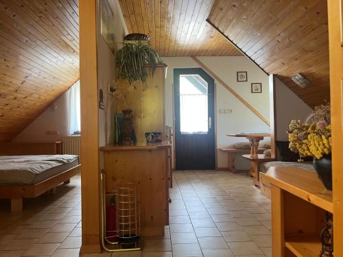 a room with a hallway with a bed and a door at Bohinj Nook Apartment in Bohinj