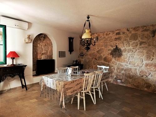a dining room with a table and chairs at Holiday Home Alegra in Podgora