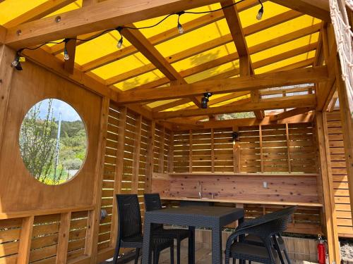 a room with a table and chairs and a window at Base Camp Spring - Vacation STAY 35488v in Shibukawa