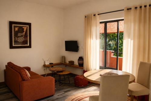 a living room with a couch and a table at Résidence Marotia in Antananarivo