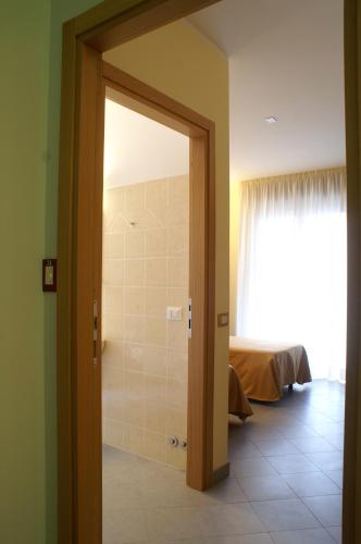 a door to a bathroom with a shower in a room at Licia B&B in Ortona