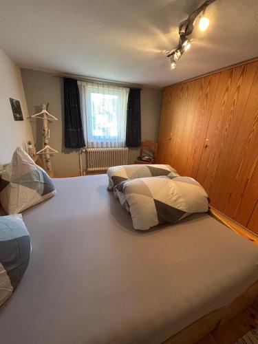a large bed in a room with two beds at Moosinest-Birkenzimmer in Schonach