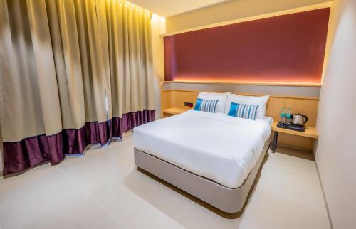 a bedroom with a large bed in a room at Indie Stays Studio Kharadi in Pune