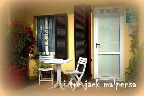 a table and chairs sitting outside of a building at I tre jack Malpensa in Case Nuove