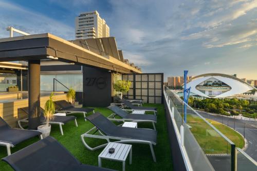 a row of chairs on the roof of a building at Barceló Valencia in Valencia