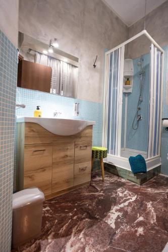 a bathroom with a sink and a shower at Casa Romana in Tor Vergata