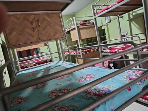 an overhead view of two bunk beds in a room at Hostel Relax Homestay in Gaya