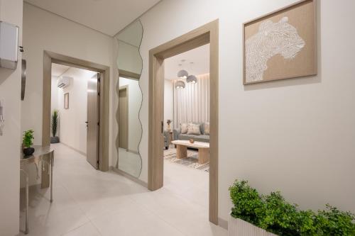 a hallway with two doors leading to a living room at الاخشبان in Jeddah