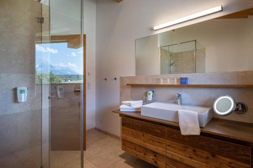 a bathroom with a sink and a shower at Appartements am Römerweg in Oberndorf in Tirol