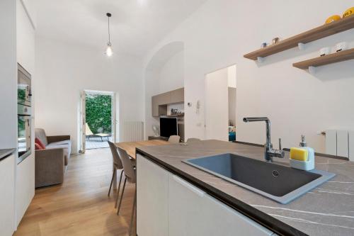 a kitchen with a sink and a counter top at Casa Vacanze Regina in Lecco