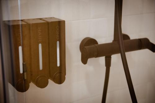 a group of wooden utensils hanging on a wall at O Recuncho do Castelo in Ribadavia