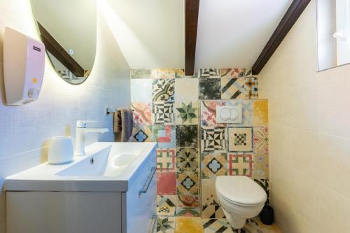 a bathroom with a toilet and a sink at Villa Loznati in Cres