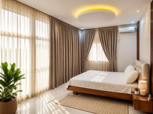 a bedroom with a bed and a large window at house for rent in Saly Portudal