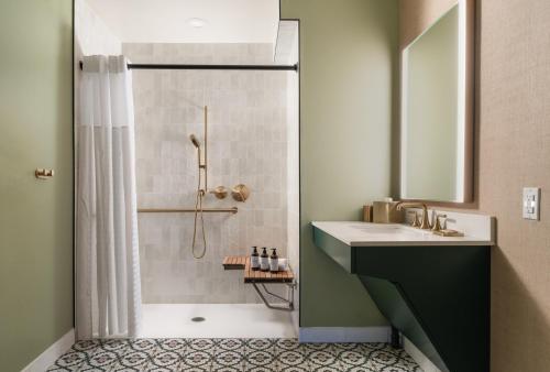 a bathroom with a shower and a sink at The Milo in Santa Barbara