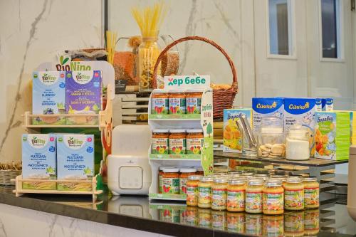 a counter topped with lots of different types of food at SPA Resort St Ivan Rilski - Halfboard & All Inclusive in Bansko